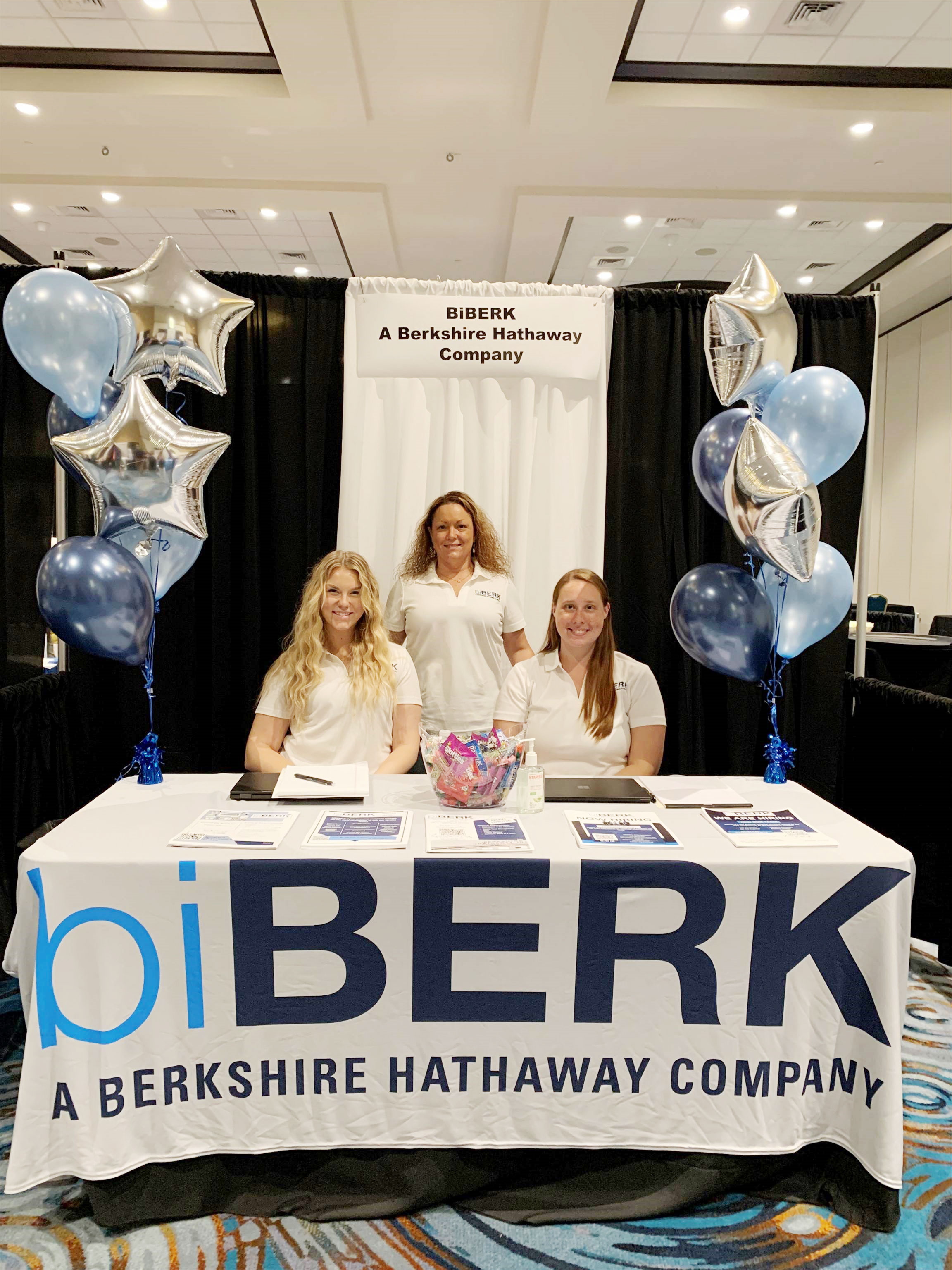 biBerk employees at booth at a convention