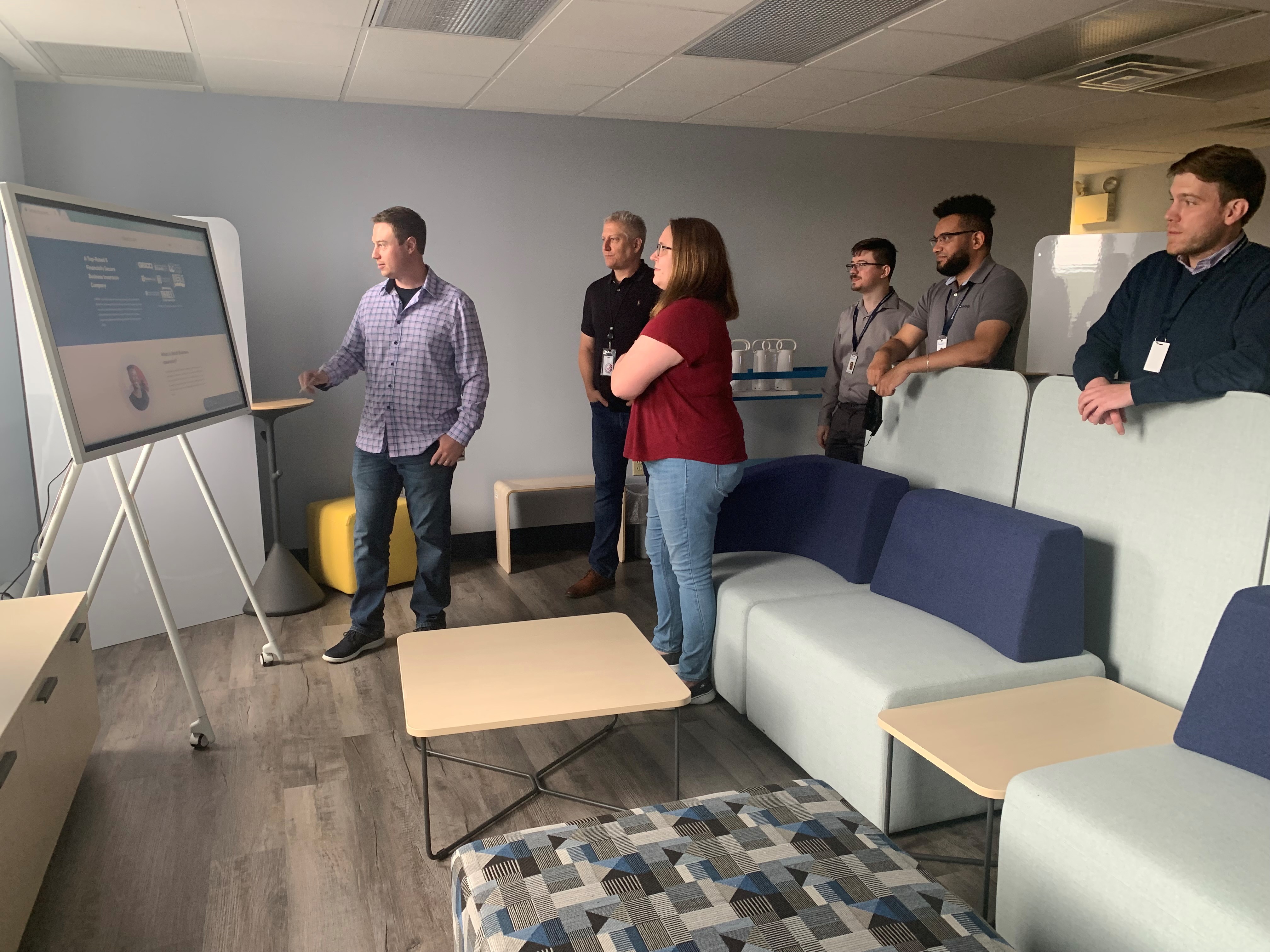 biBerk employees watching a presentation