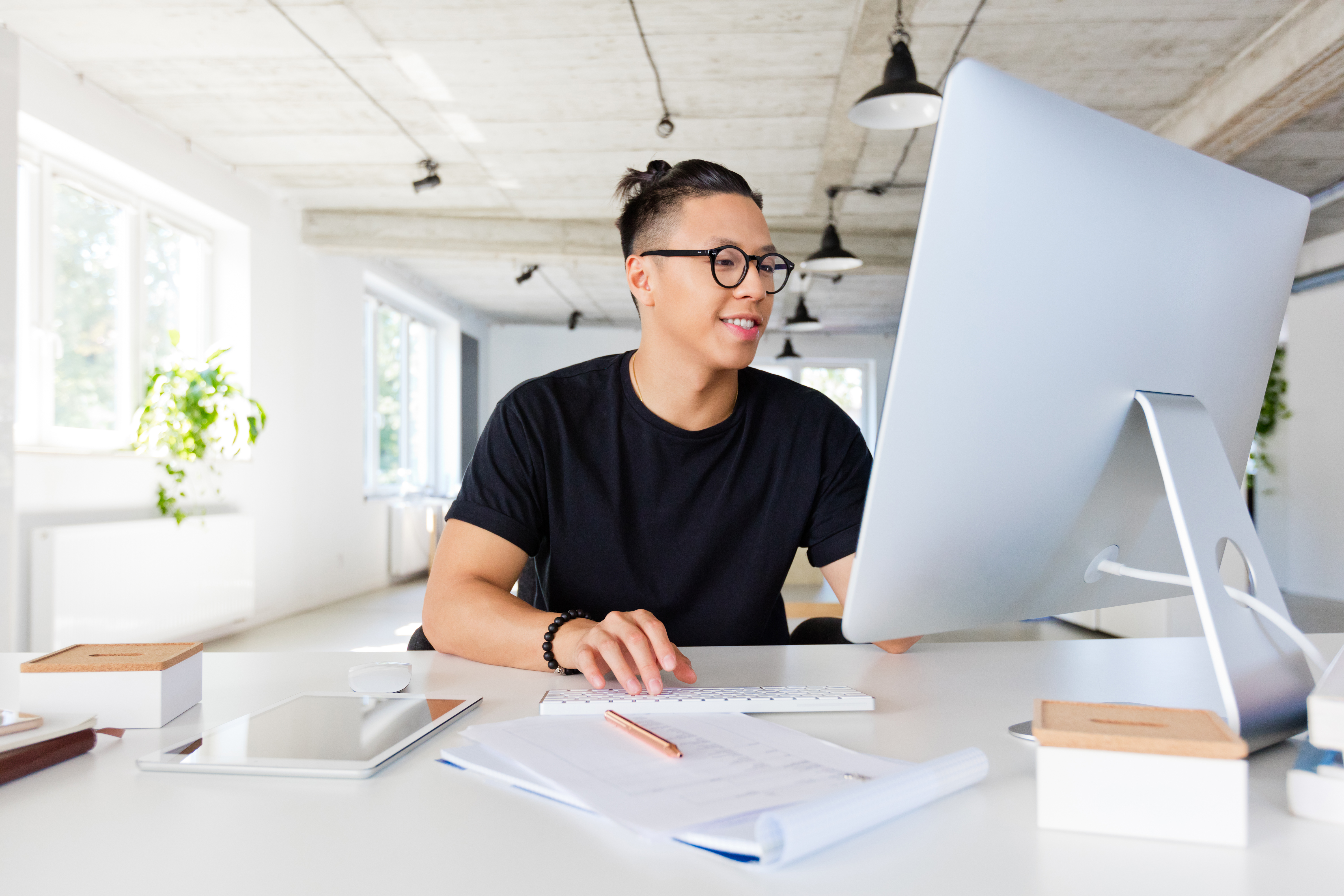 Graphic designers sits in front of computer